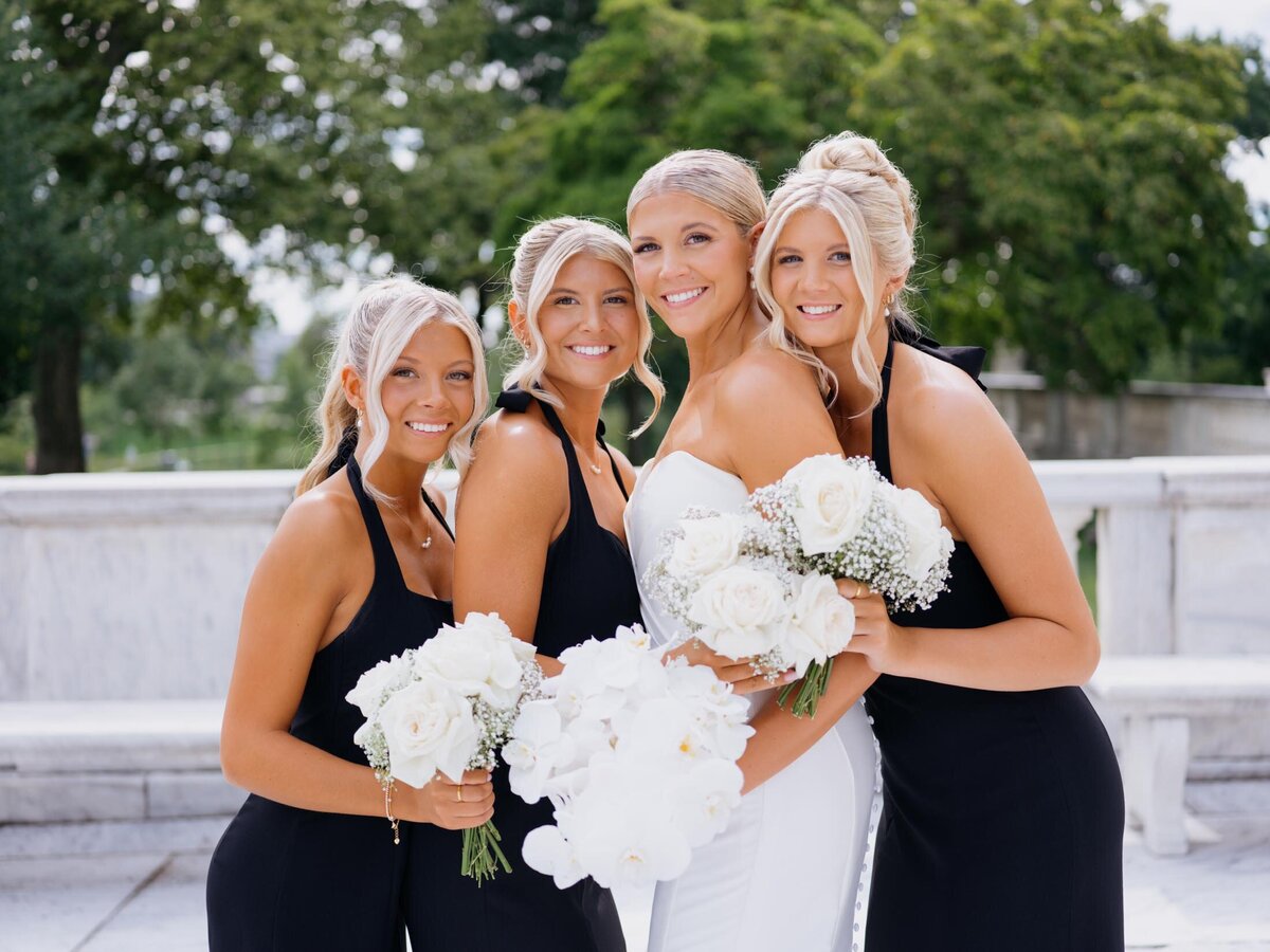 Bride with bridesmaids in black and white at Cleveland Art Museum