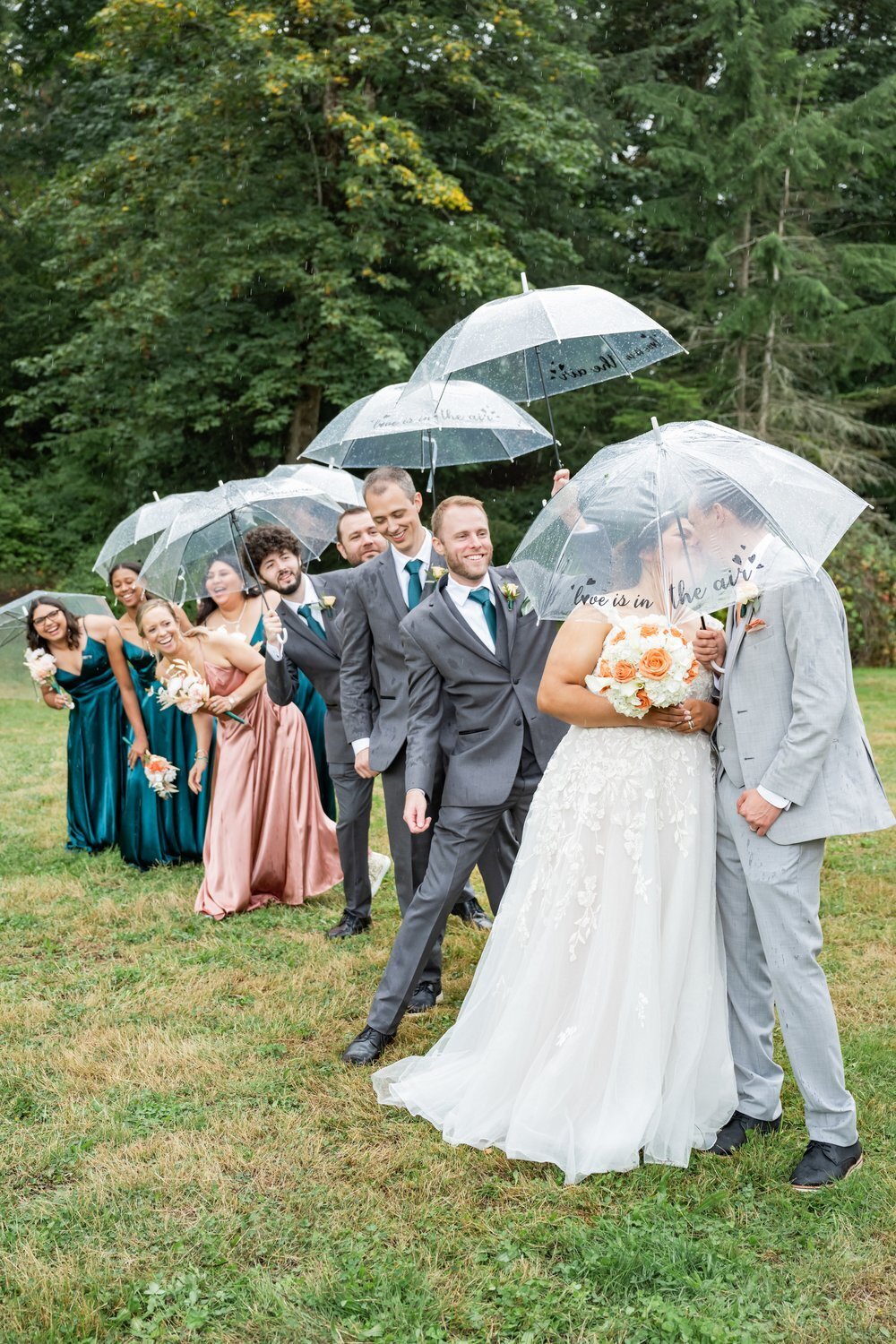 wedding party portraits under umbrellas pnw