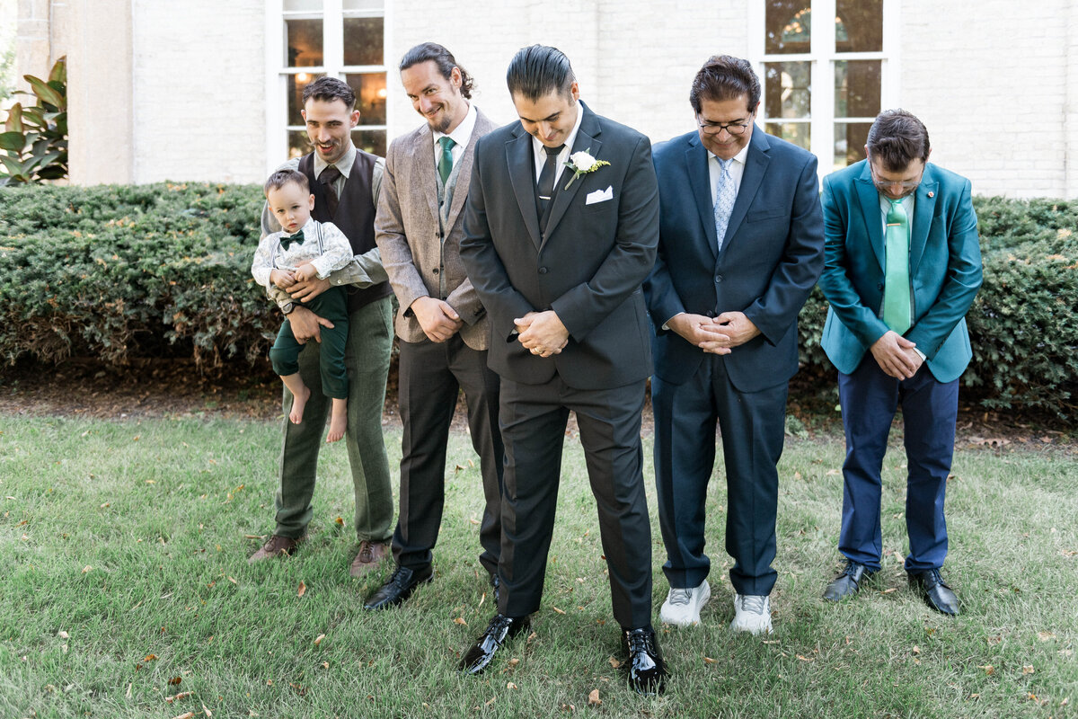 Candid smiles during wedding group photo