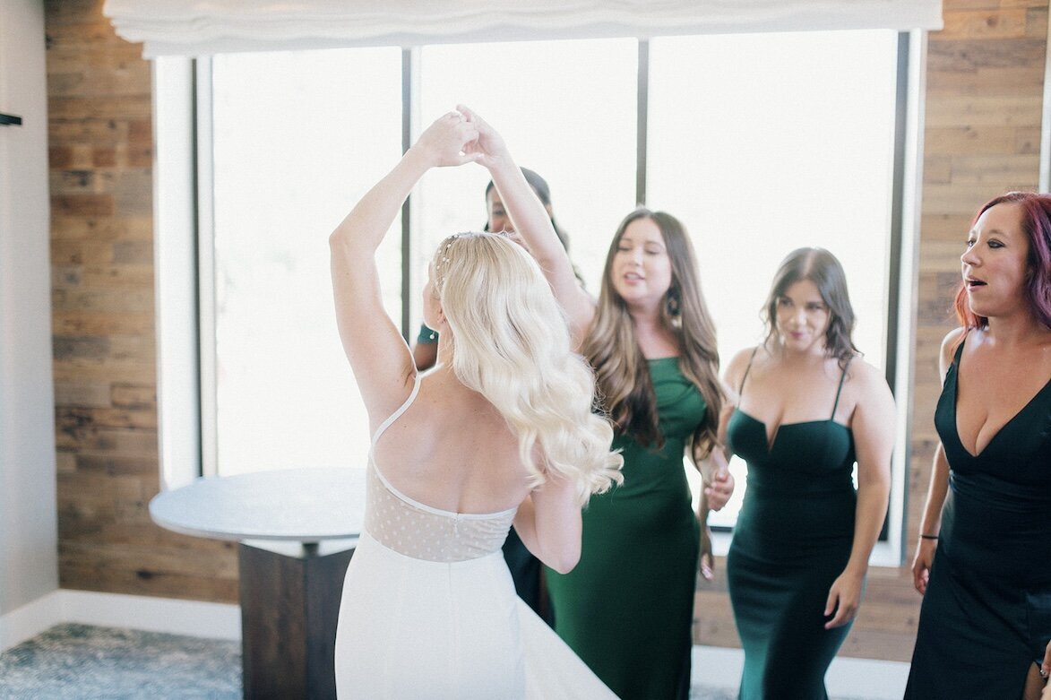 bride dancing with her friends