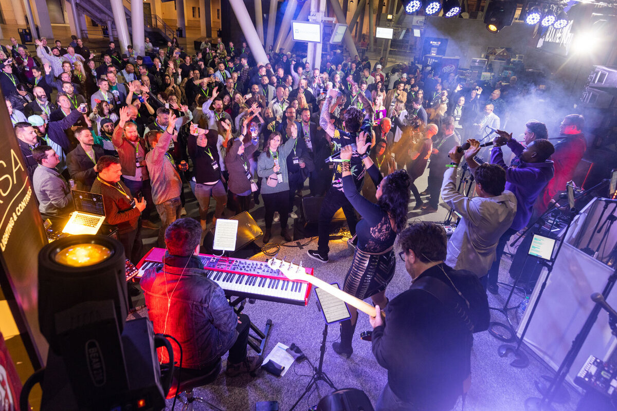 Music performance with keyboardist and singer engaging a crowd