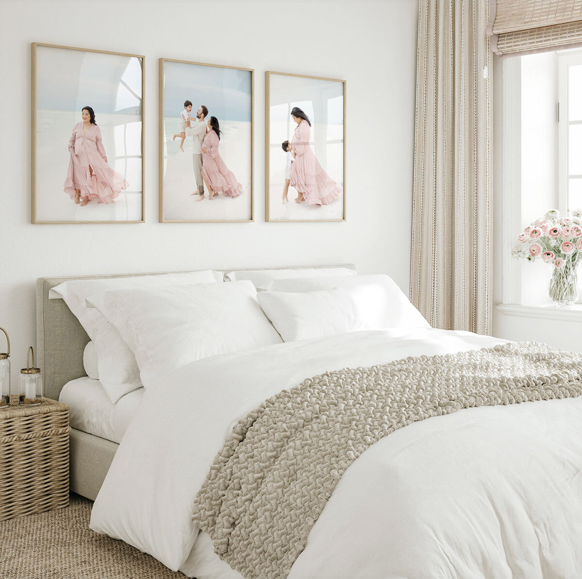 Three framed beach photos of a mother and child styled above a bed