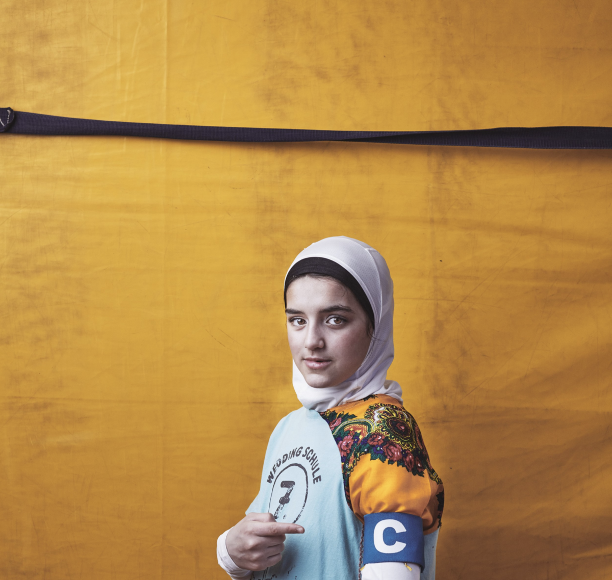 A director in frame, lit with ambient window light for a soft profile.