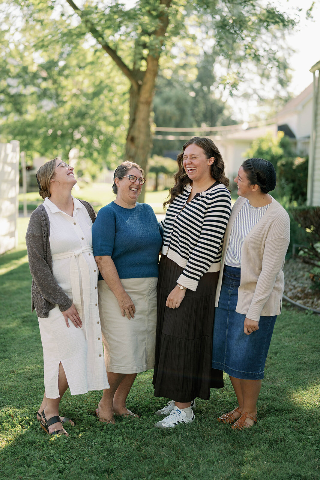 Outdoor group portrait of the planner company team during their branding session in Indiana.