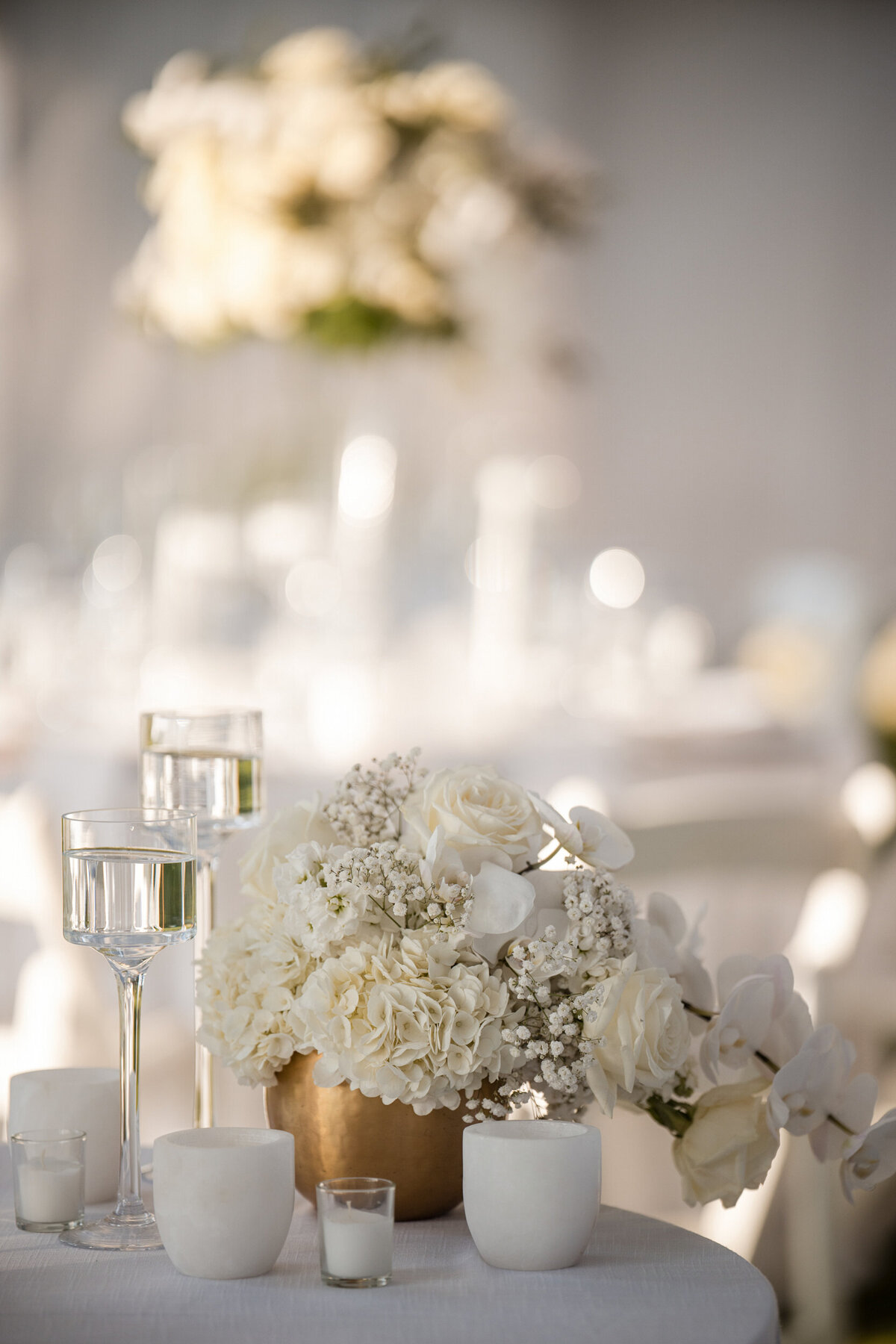 An all white decorated tent at a destination wedding in Vermont