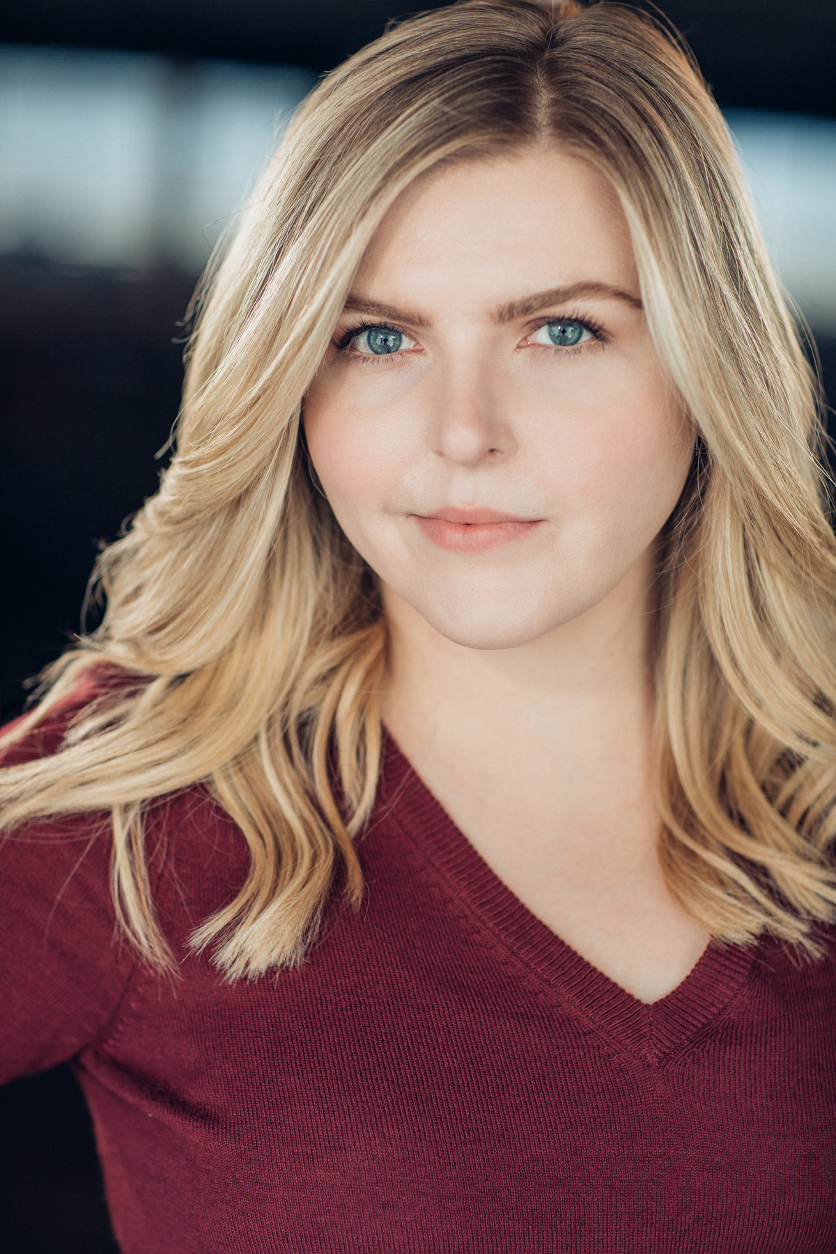 Headshot Photograph Of Young Woman In Maroon V-Neck Shirt Los Angeles