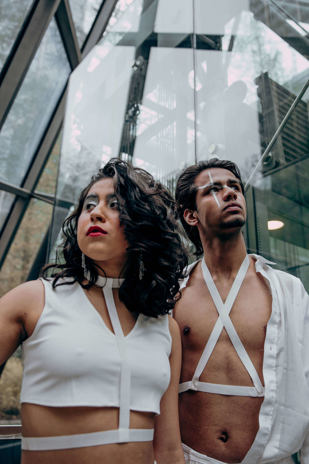 Cherie and Saad stood in a glass structure wearing all white.