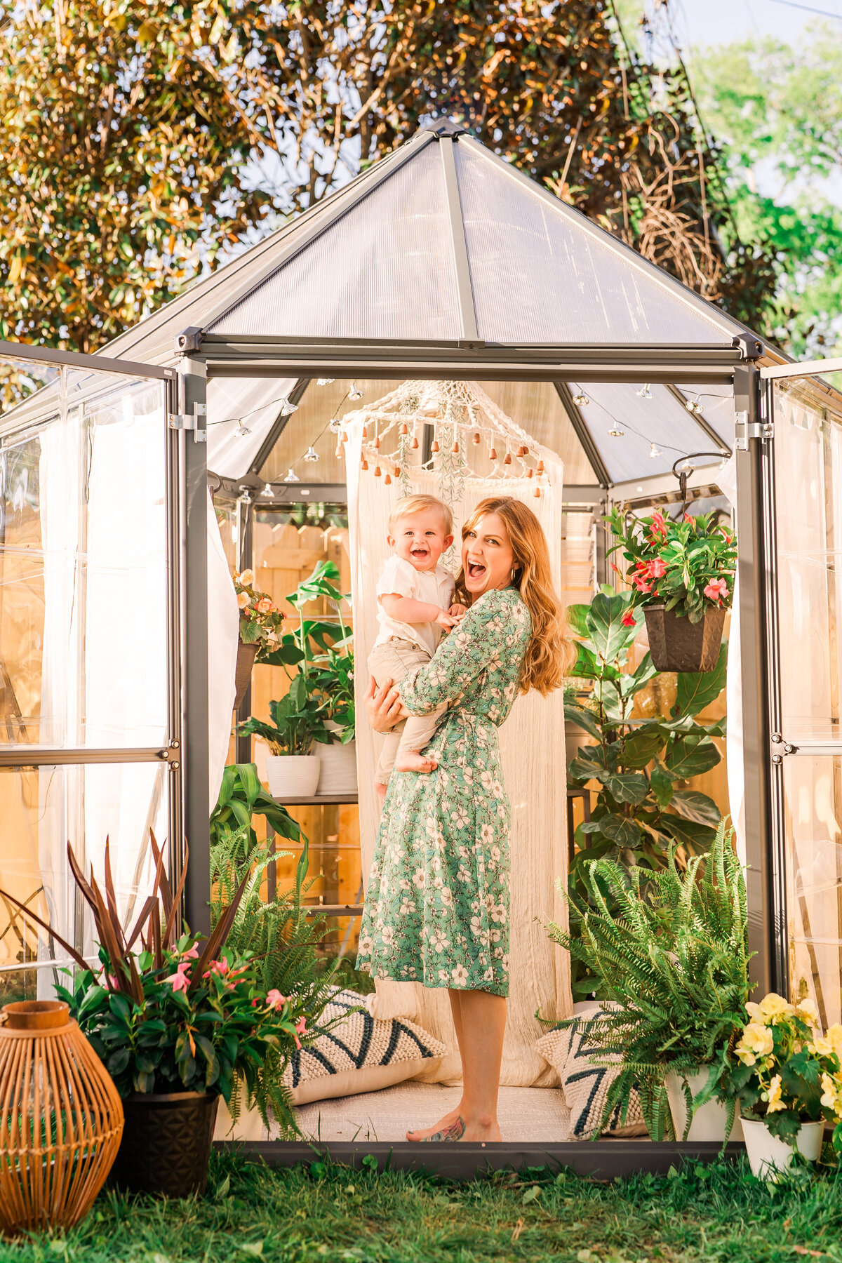 Mother and son cuddle in greenhouse studio space in Chattanooga, TN