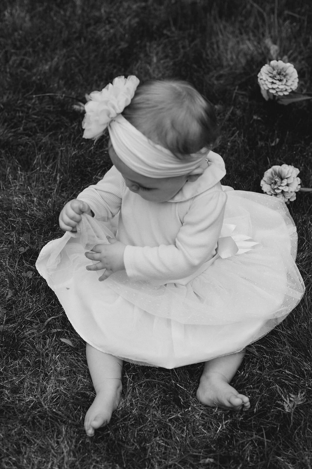 baby hanging out in the flowers