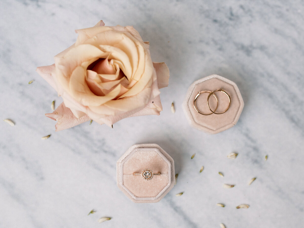 Flower and rings on a flatlay