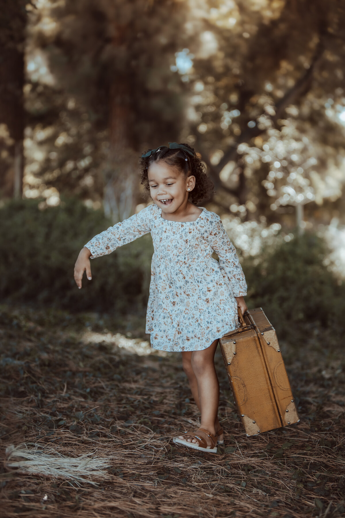 Little Girl Walking with Vintage Suitcase – Prospect Park Redlands Family Session