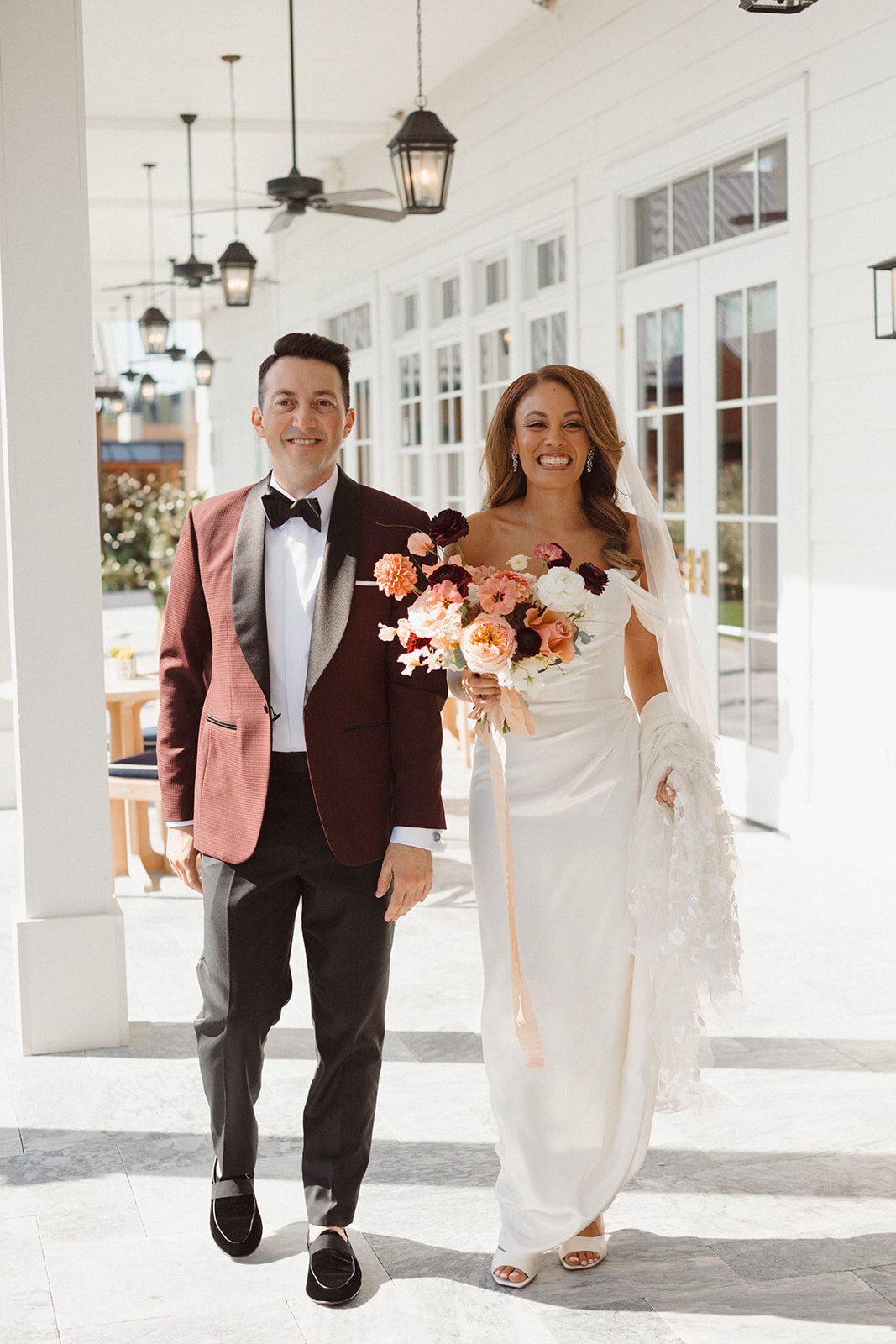 Bride and groom walk the grounds at The Lake House on Canandaigua