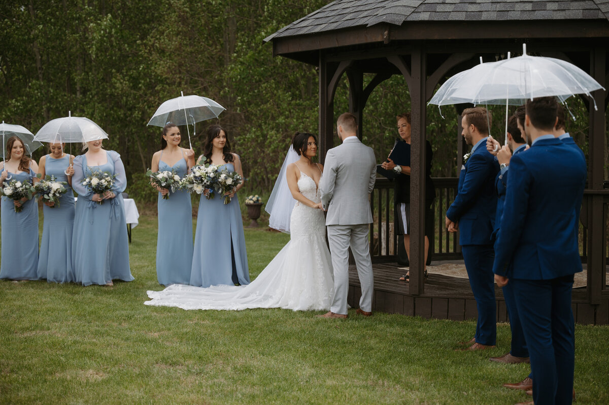 bride and groom exchanging vows at Alberta ceremony