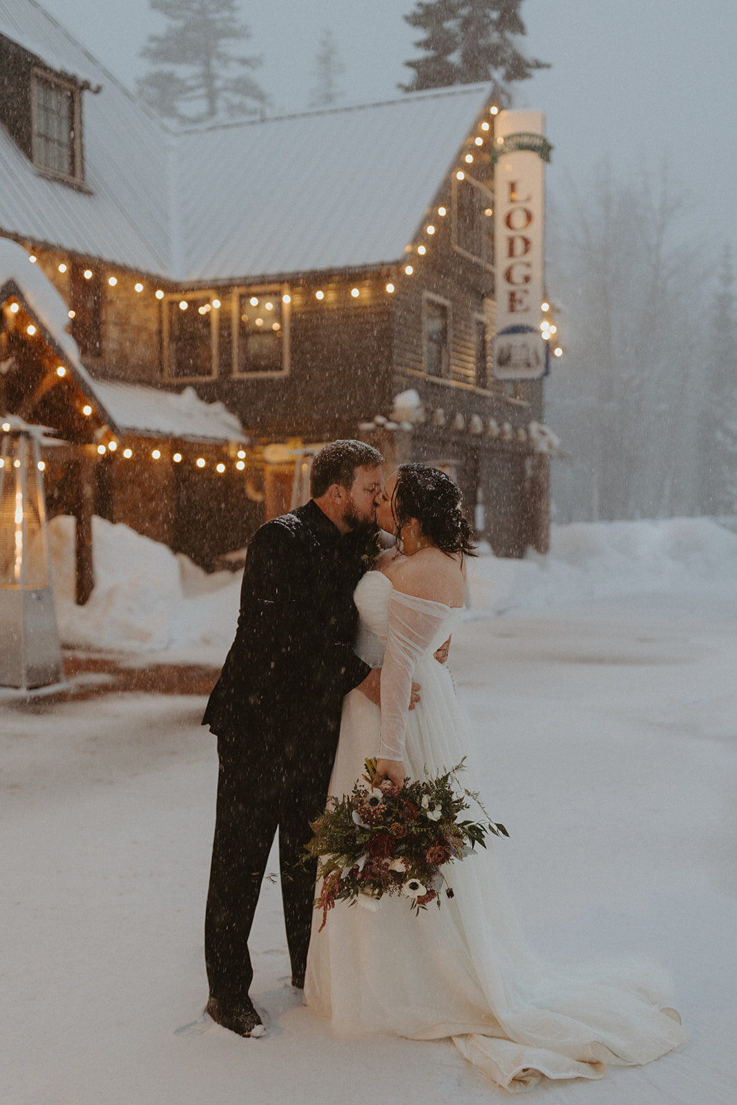 Bride and Groom Kissing in the snow