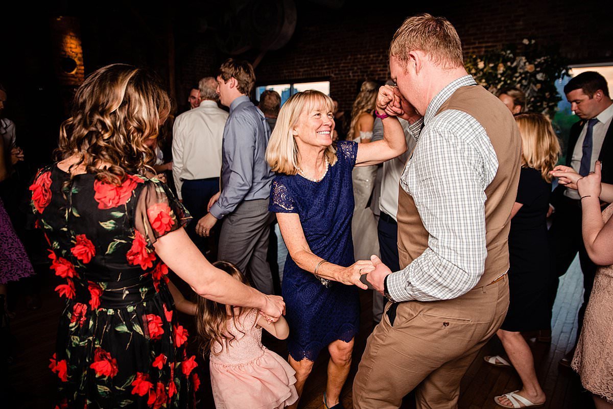 Guests dancing together on a full dance floor