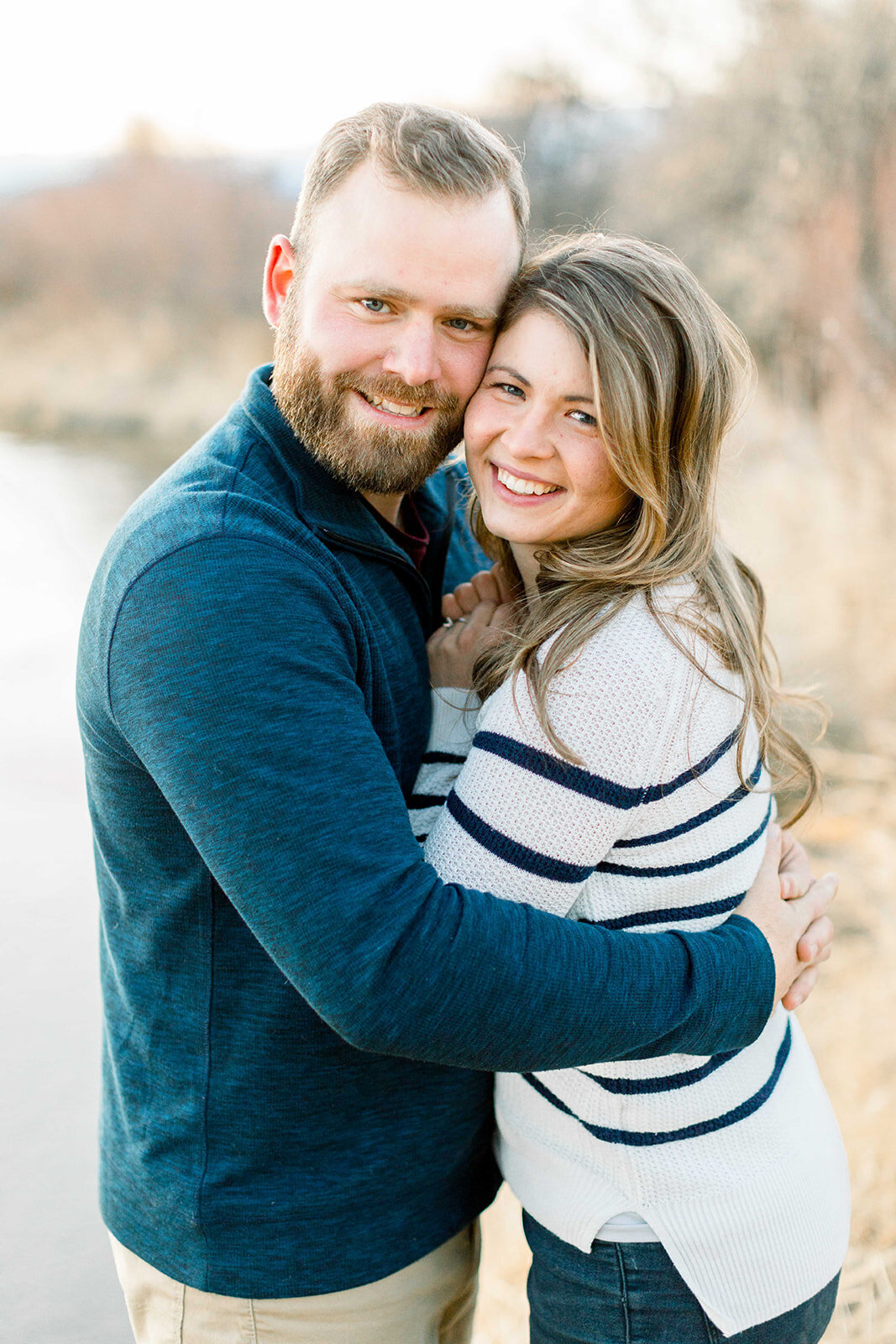 Couple Smiling at the camera for their engagement session