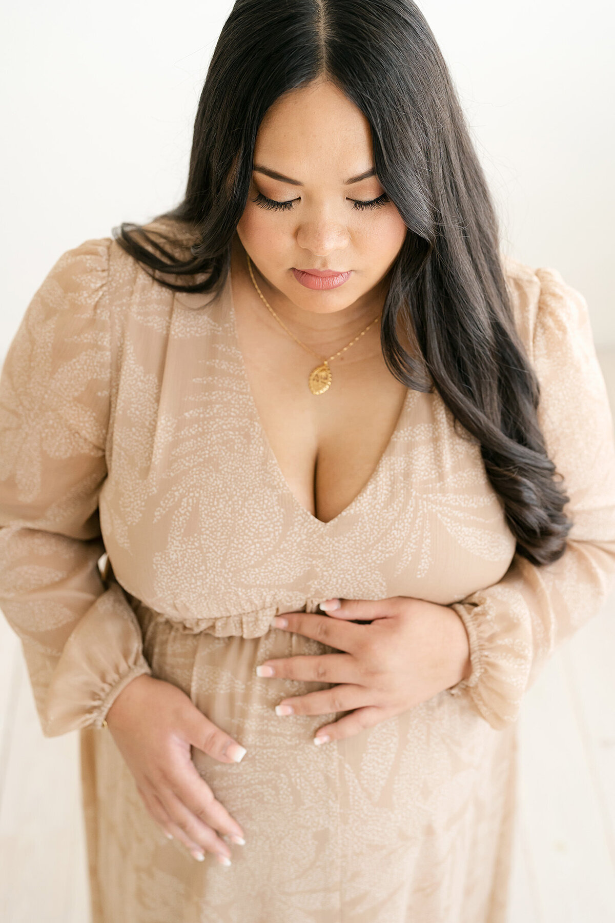 Pregnant mom wearing brown dress for Louisville KY maternity photography session