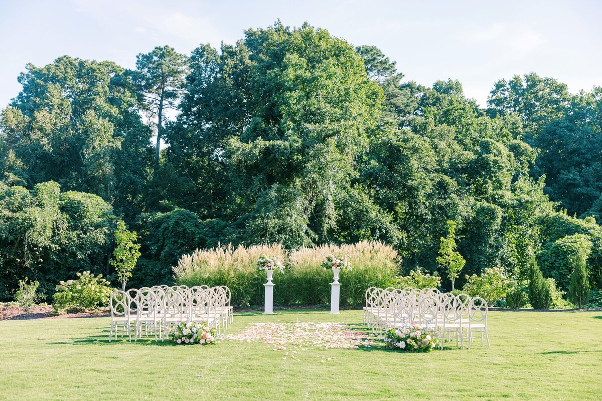 white chairs on lawn  wedding ceremony
