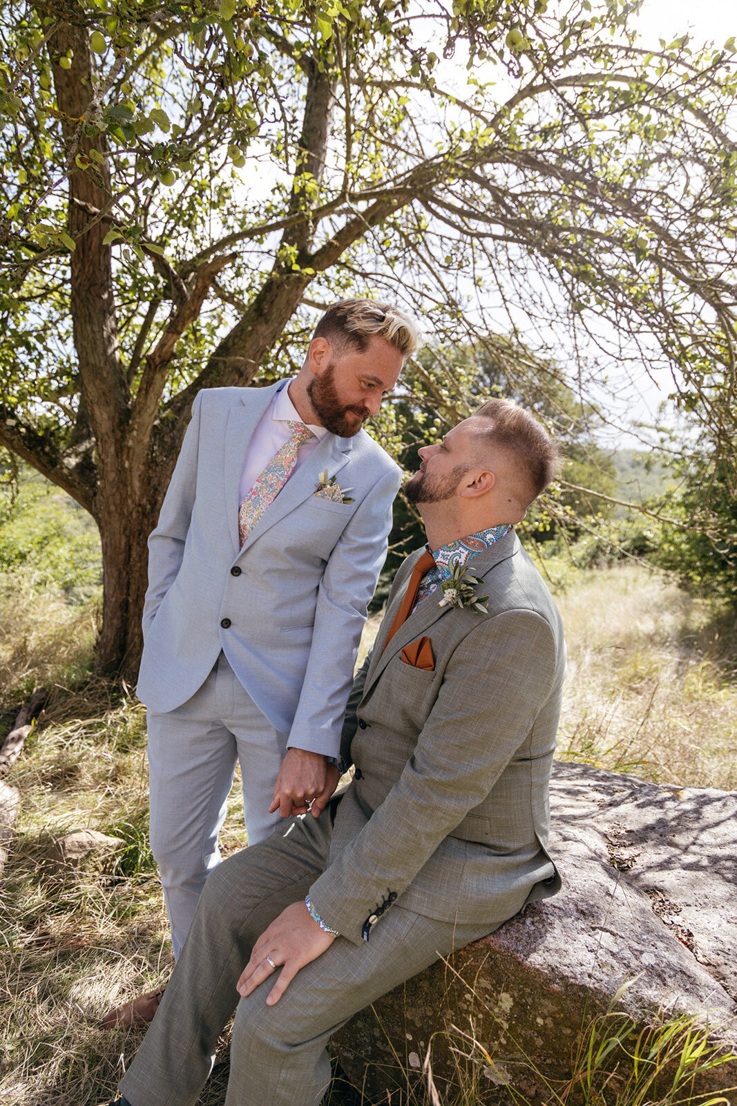A guy couple looking at each other during their all inclusive adventure elopement in Scandinavia