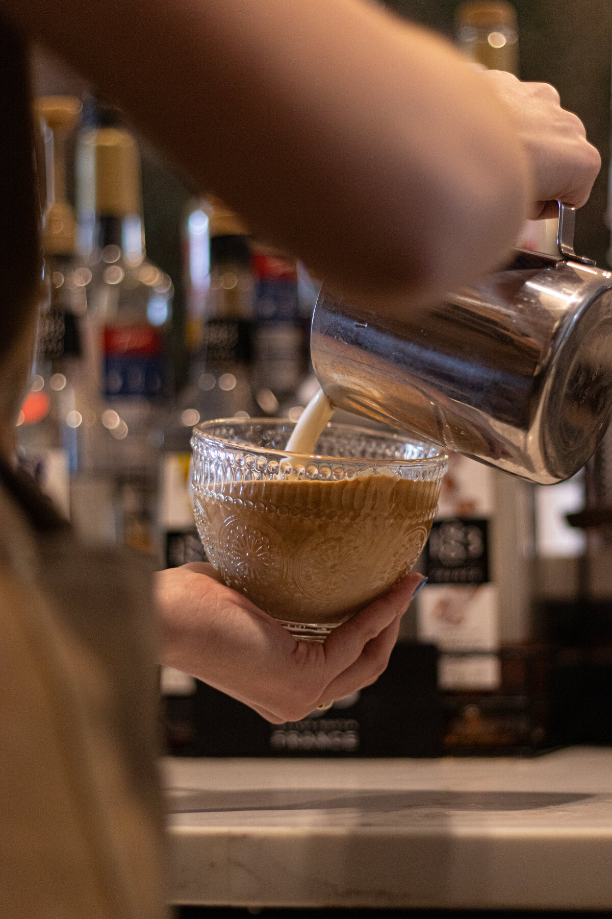 a barista making a latte