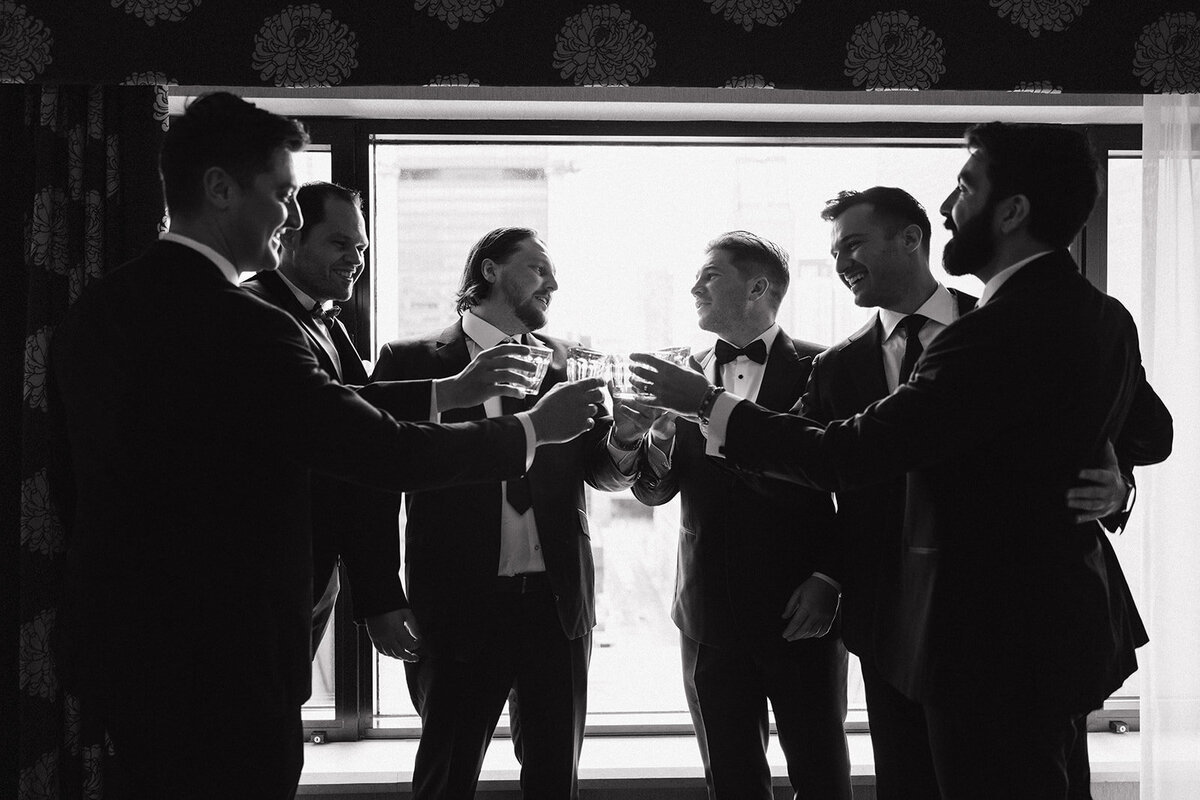 groom-gettingready-cheers-groomsmen-montreal-wedding