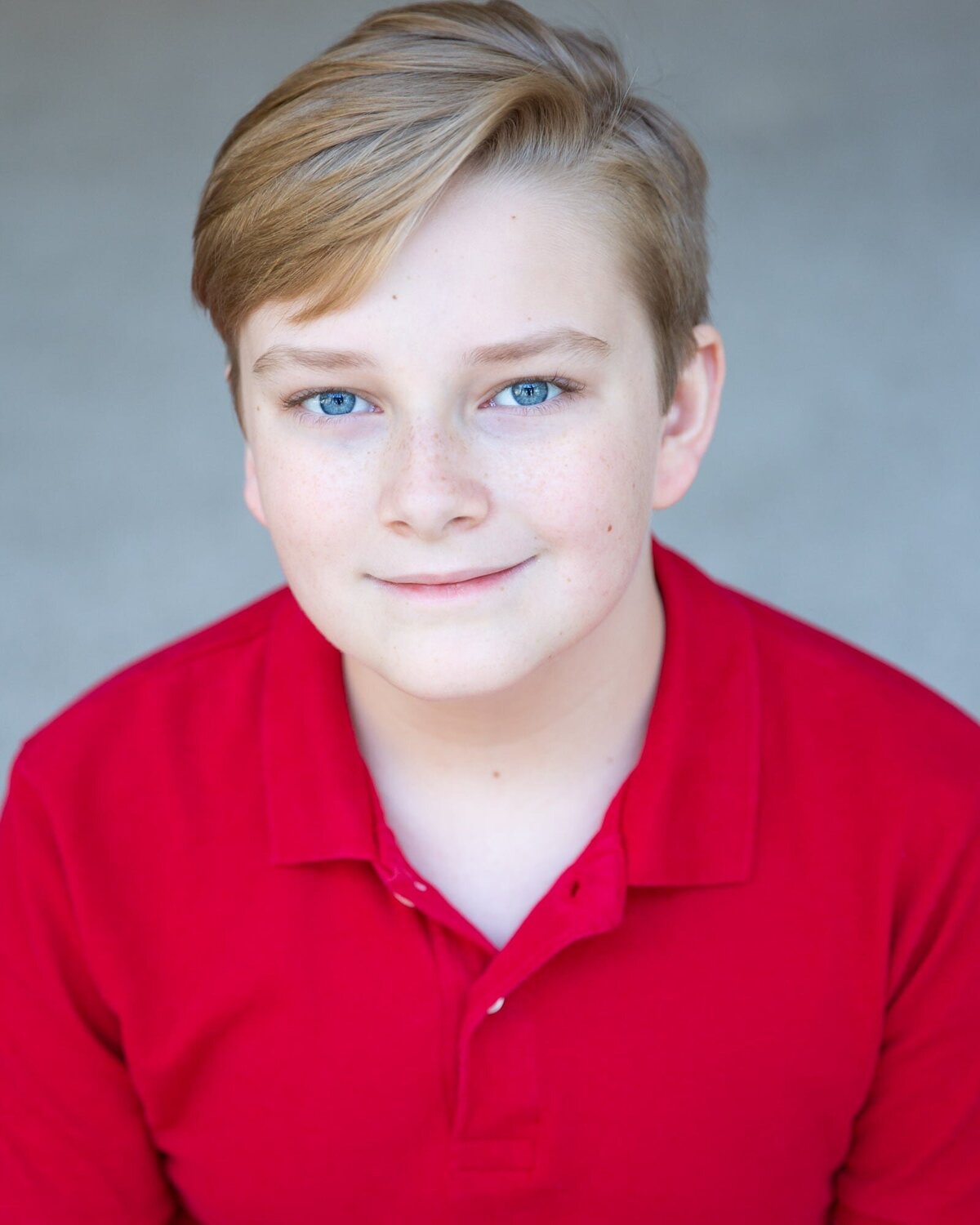 Boy in a bright red shirt for his actor headshots