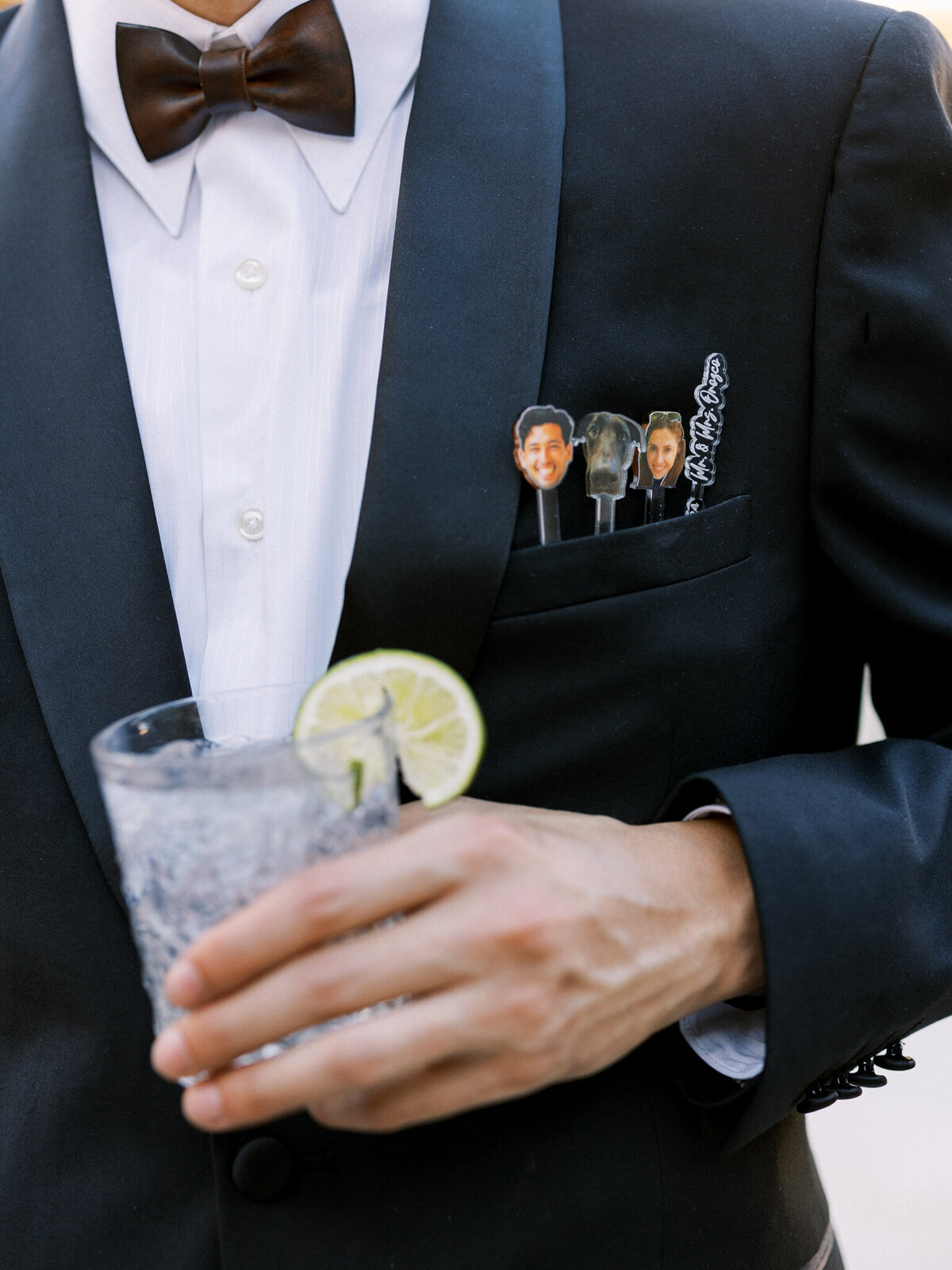 Personalized drink stirrers and a classic cocktail—playful wedding details that bring personality to a black-tie celebration