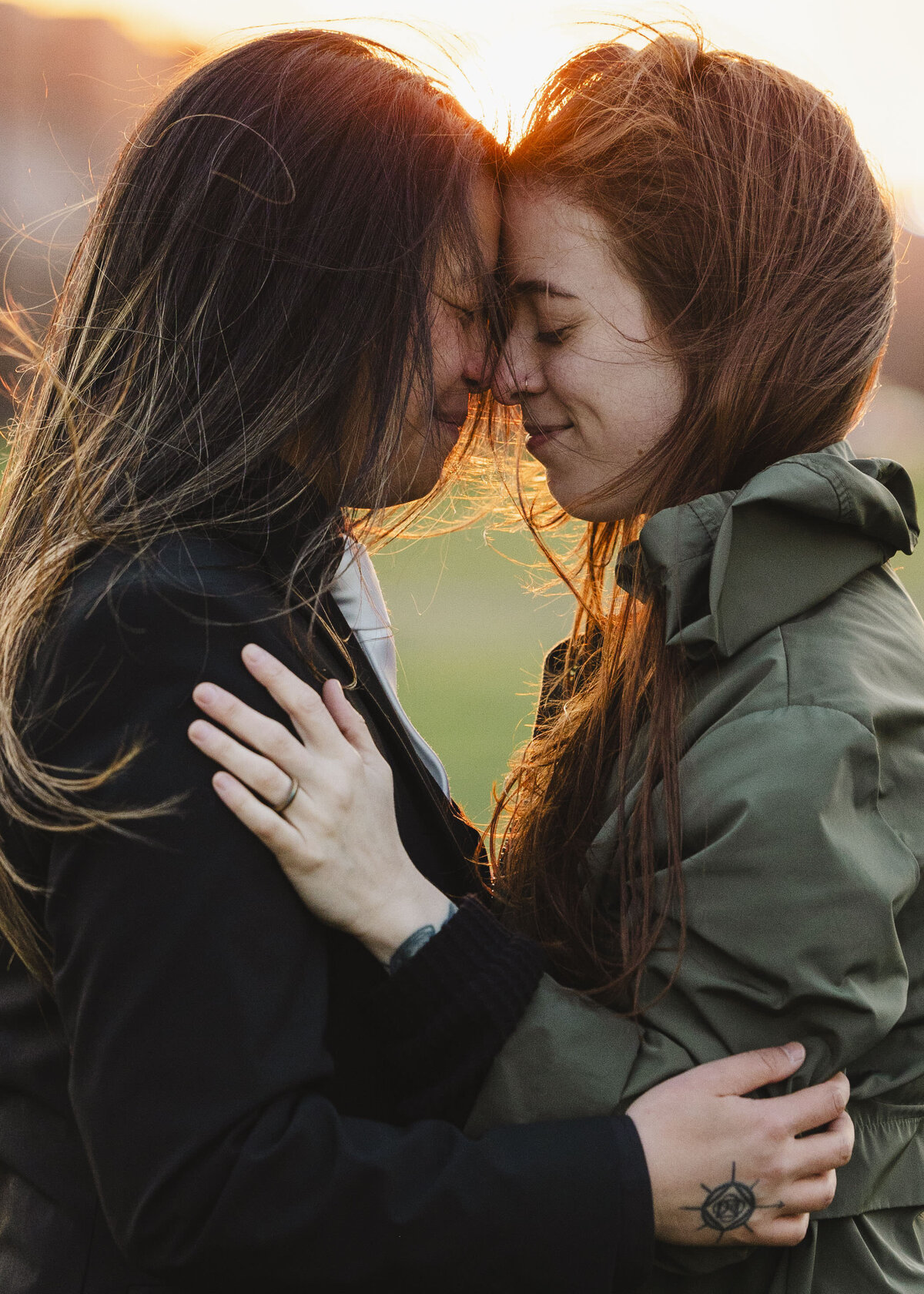 A couple holds one another, forehead to forehead.