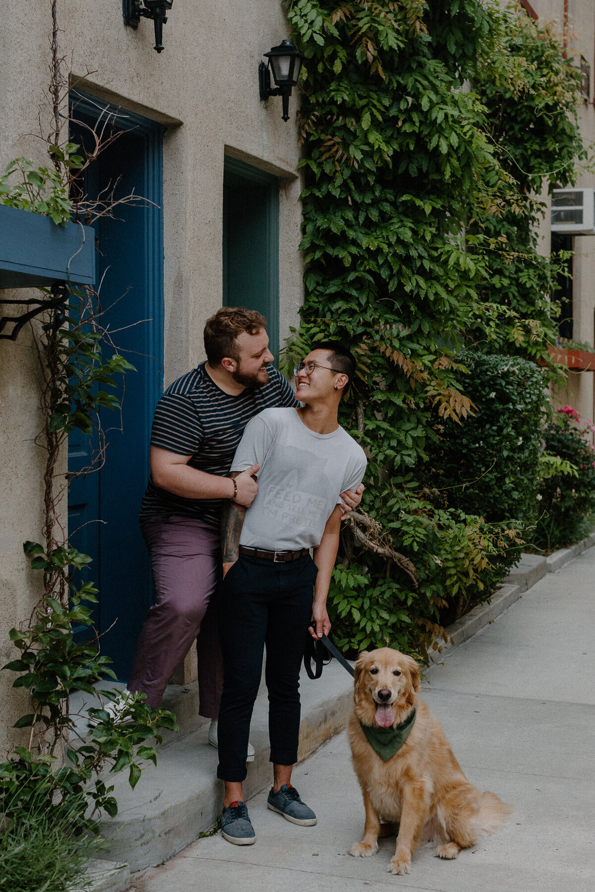 engaged men with dog in new york city