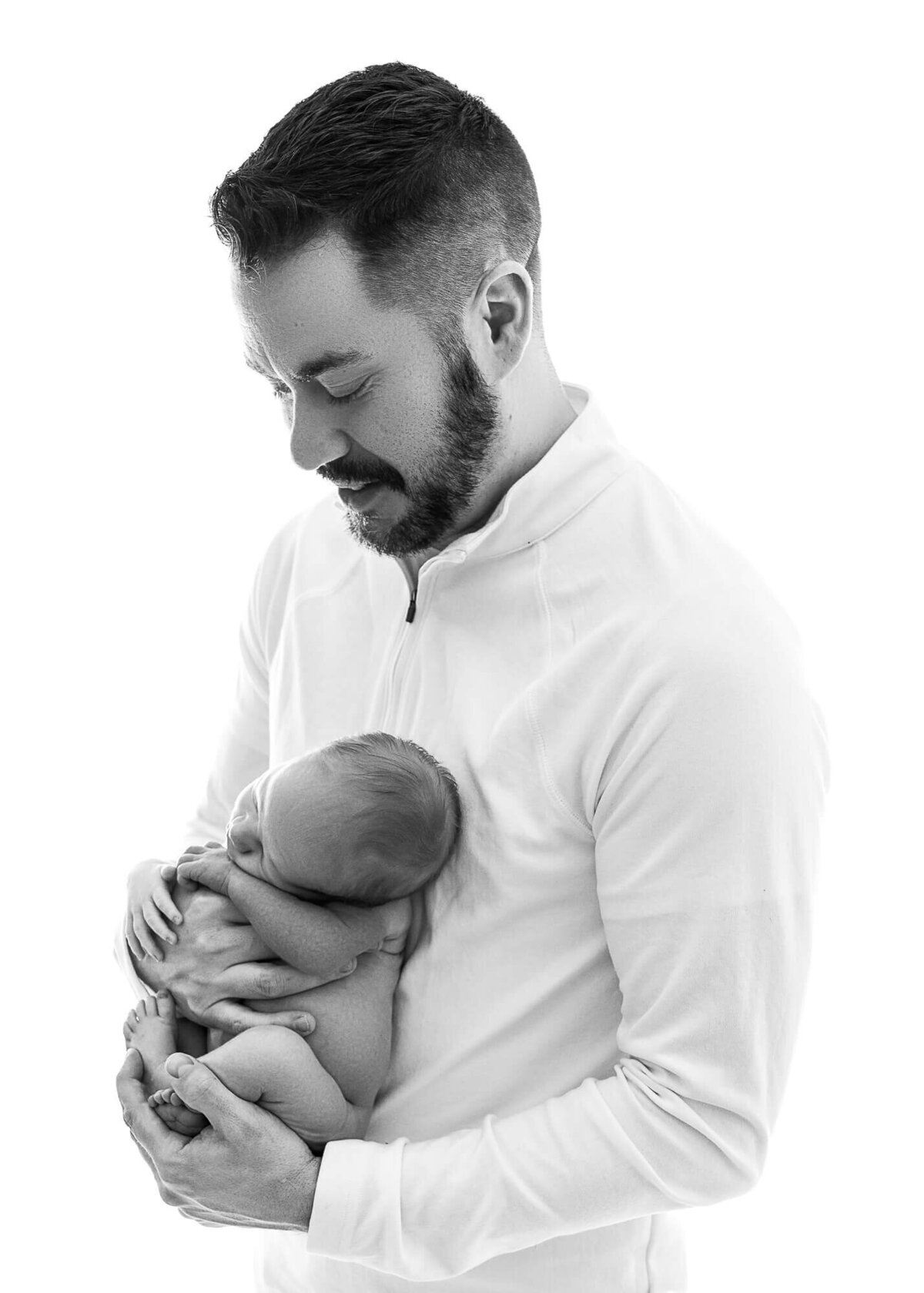 High-Key portrait of dad holding baby
