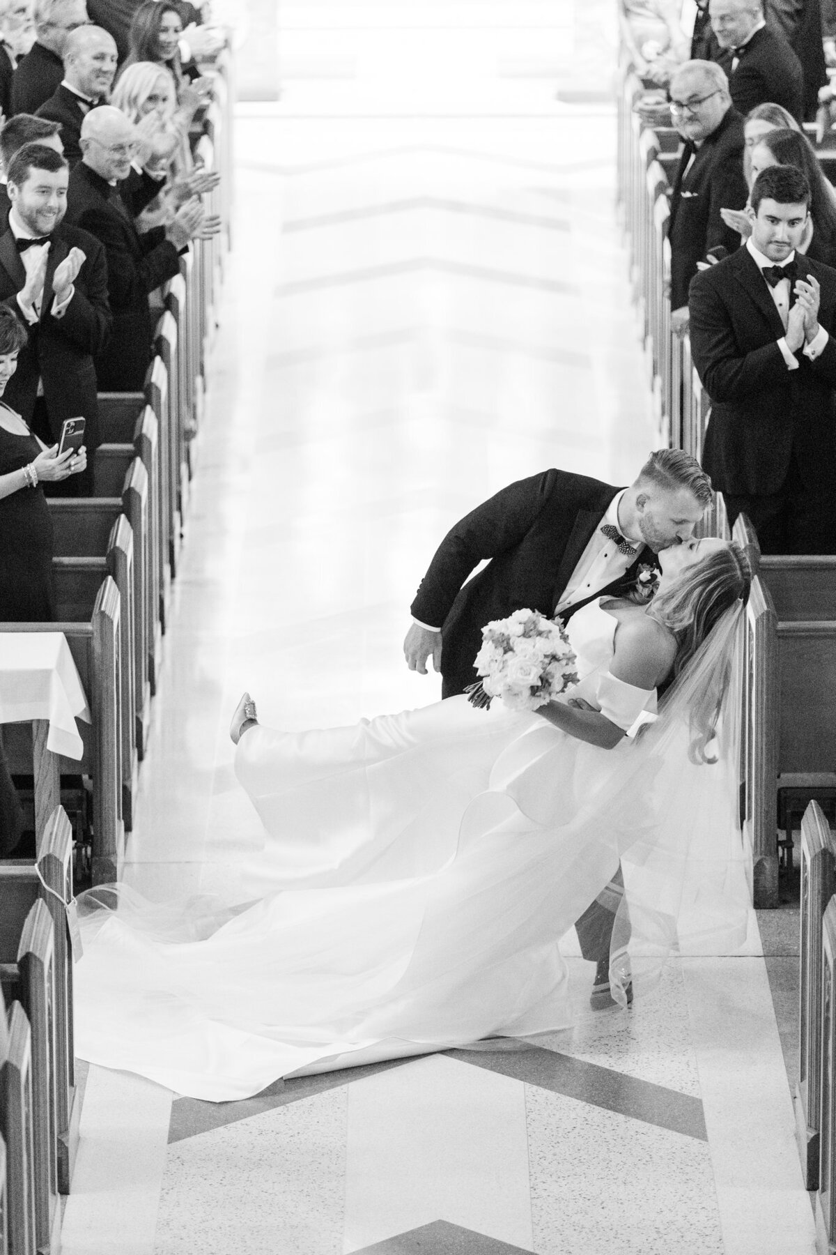 Groom dips Bride with a Kiss during Cermony recessional