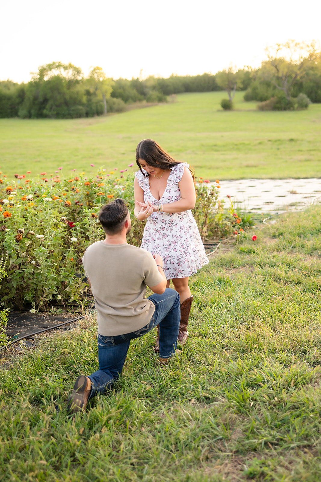 man on one knee proposing to girl