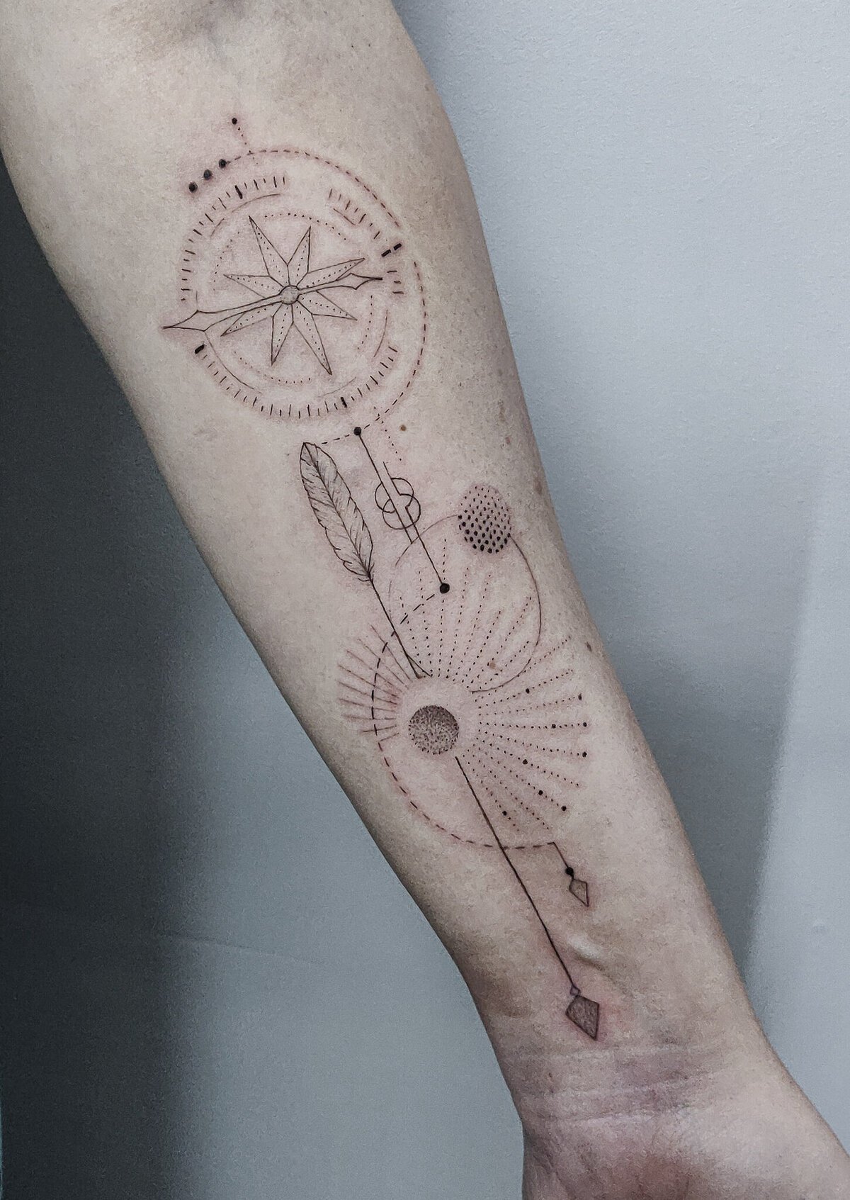 compass tattoo, geometric tattoo, arrow tattoo, feather tattoo