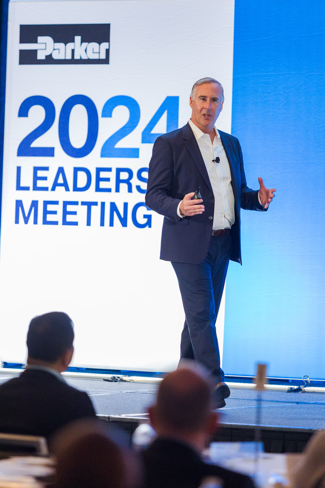Man giving a presentation on stage during during business convention Westin Buckhead