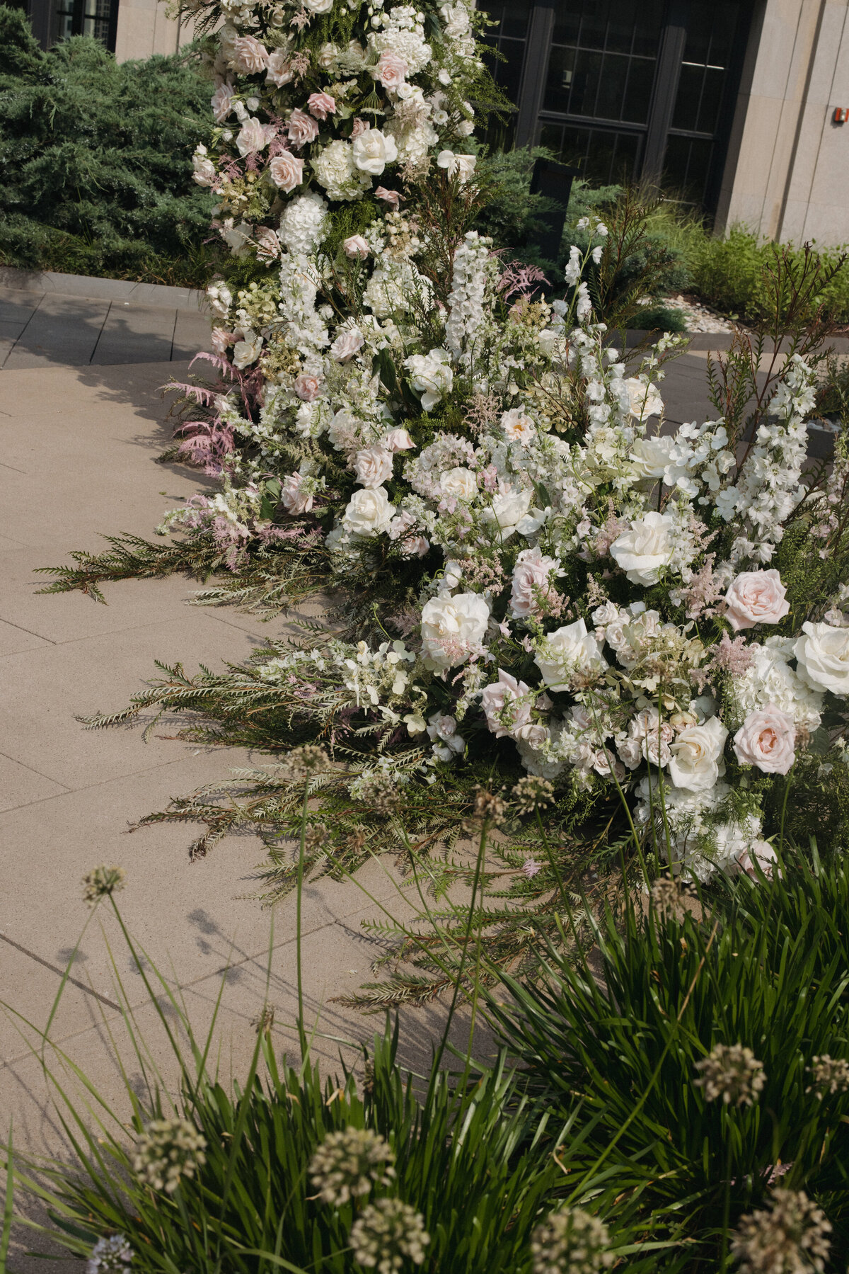 Sophisticated editorial wedding photography captures ceremony moments at Old Post Office Chicago, featuring Lauren Alatriste's fashion forward approach combining architectural grandeur with magazine-worthy imagery and authentic wedding day emotion.