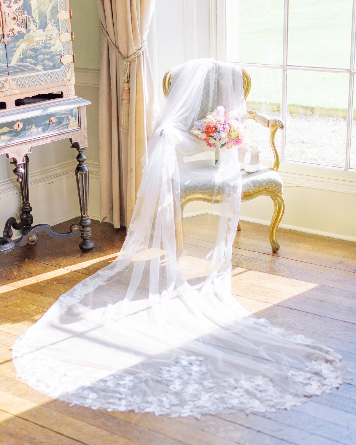 Veil, wedding bouquet and bridal shoes at Prestwold Hall