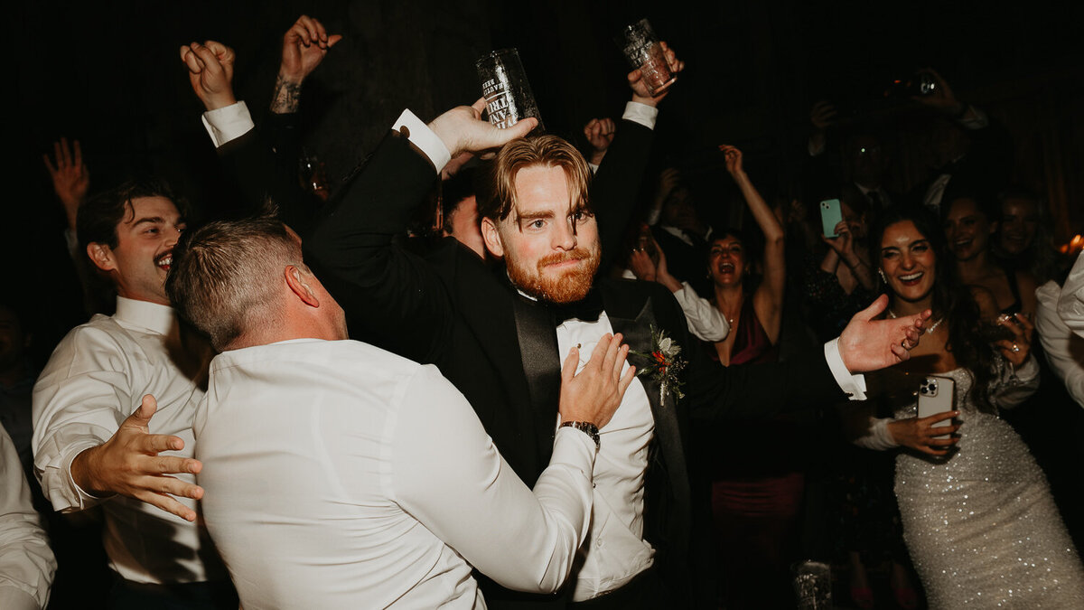 Wedding guests dance with the Bride and Groom at their wedding at The Mount Without. 
