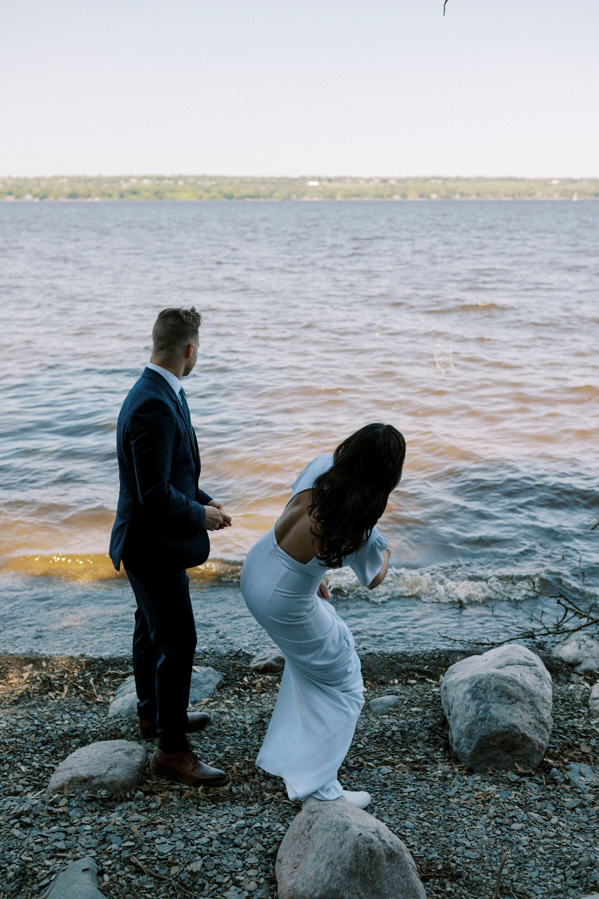 An intimate and romantic elopement at Constance Bay, featuring a serene beachfront ceremony with a breathtaking sunset backdrop. This elegant setup includes a chic floral arrangement and soft, glowing lanterns, perfect for couples seeking a secluded and picturesque elopement location