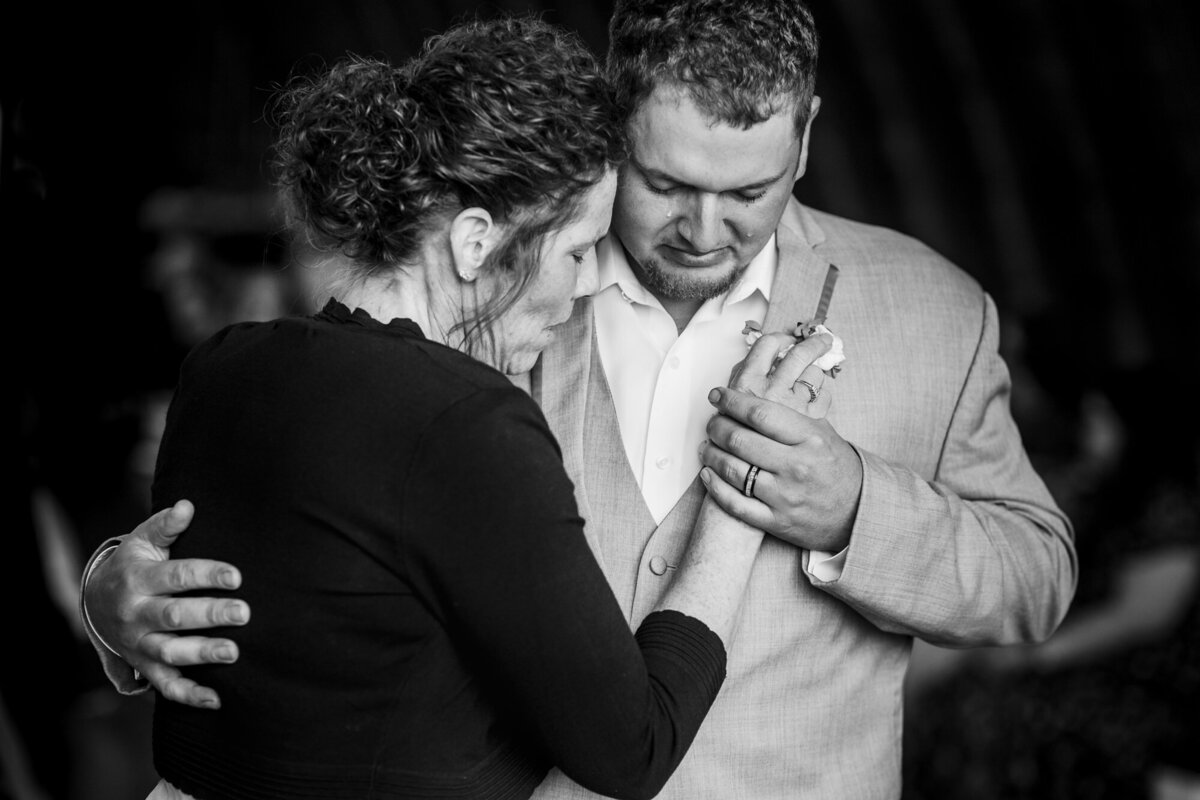 Groom dances with his mom during his wedding in Austin, Texas. Photo taken by Austin wedding photographers, Joanna & Brett Photography