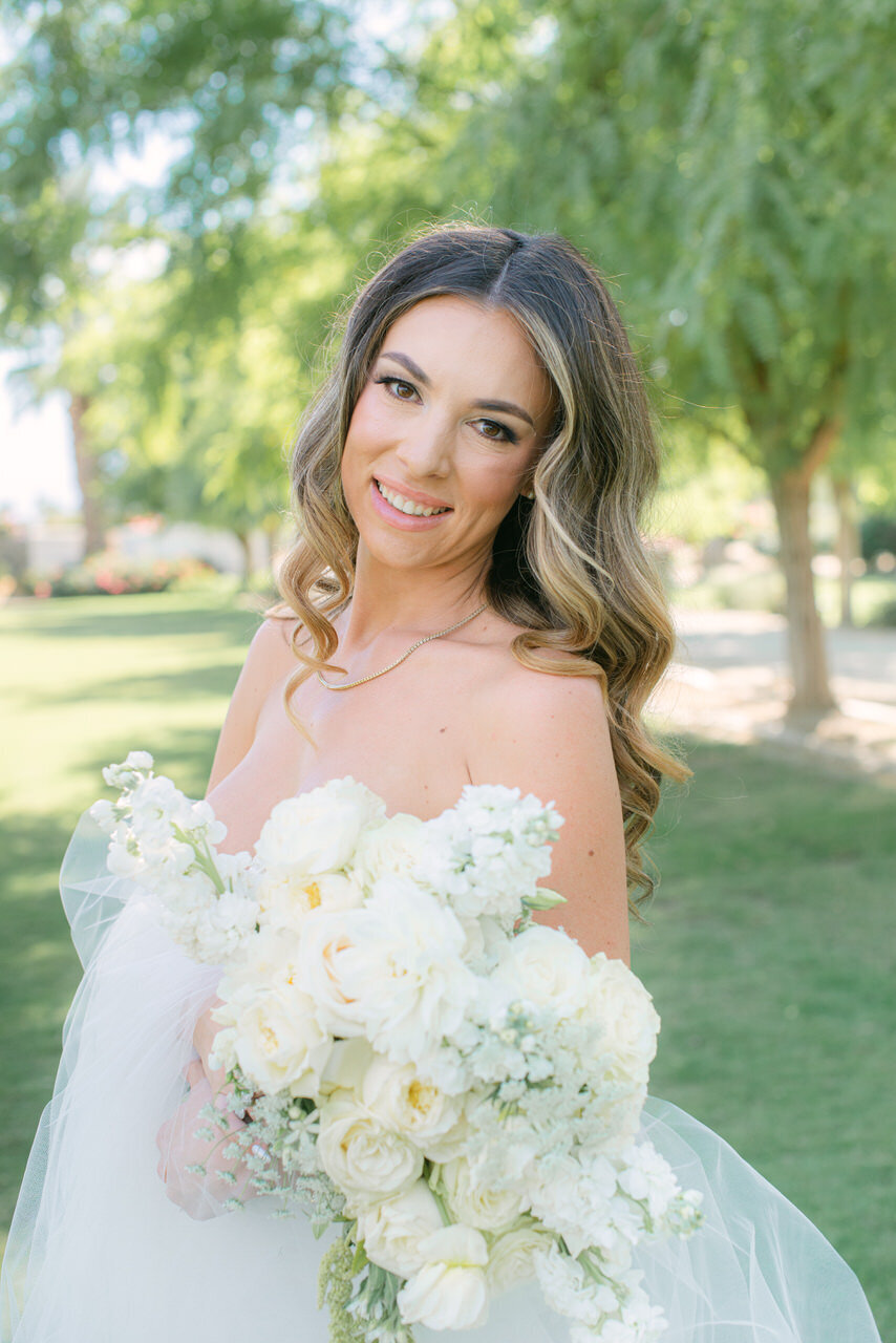 A radiant bride holding an elegant white bouquet, captured in a refined editorial style by Elizabeth Kane Photography—serving Philadelphia, New York, and DC.