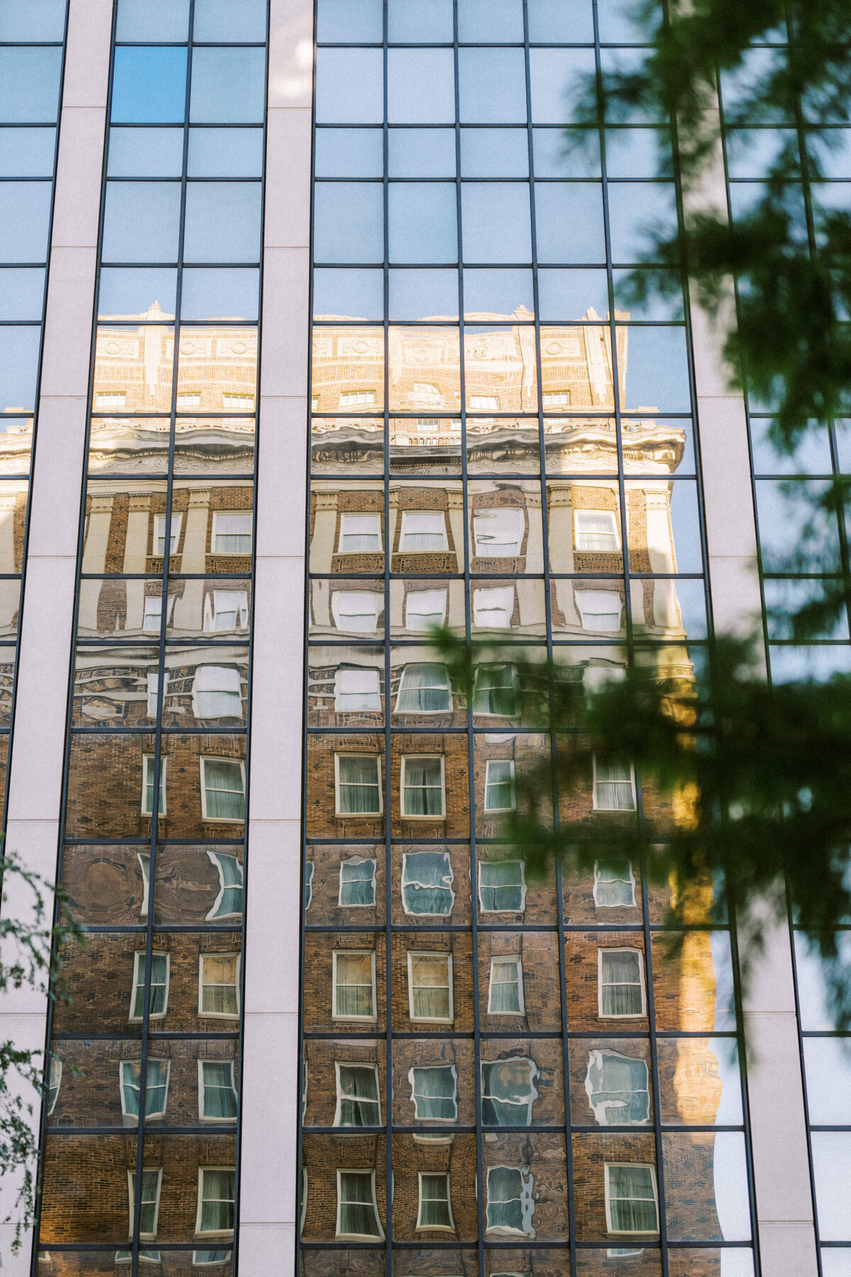skirvin-hotel-reflection-in-glass-building-downtown-okc
