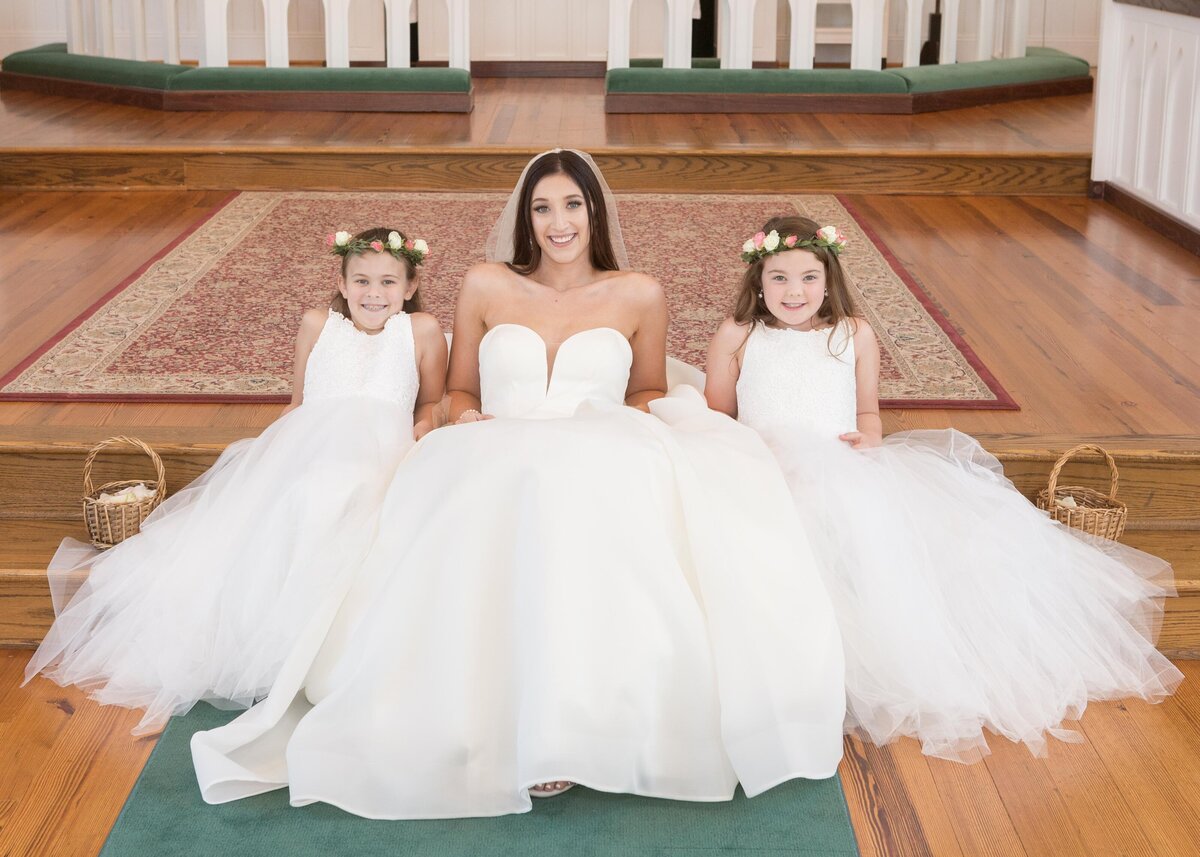 The bride and her flower girls relaxing before the ceremony.