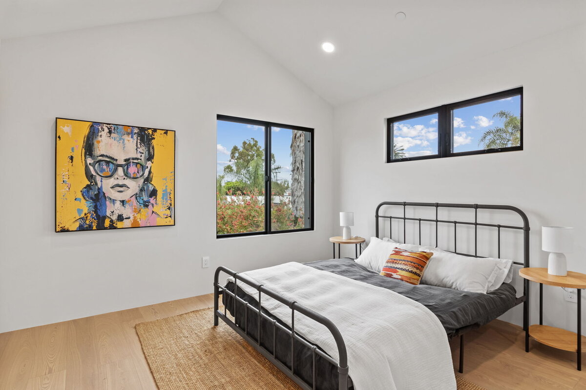 modern-bedroom-artwork-large-windows-natural-light