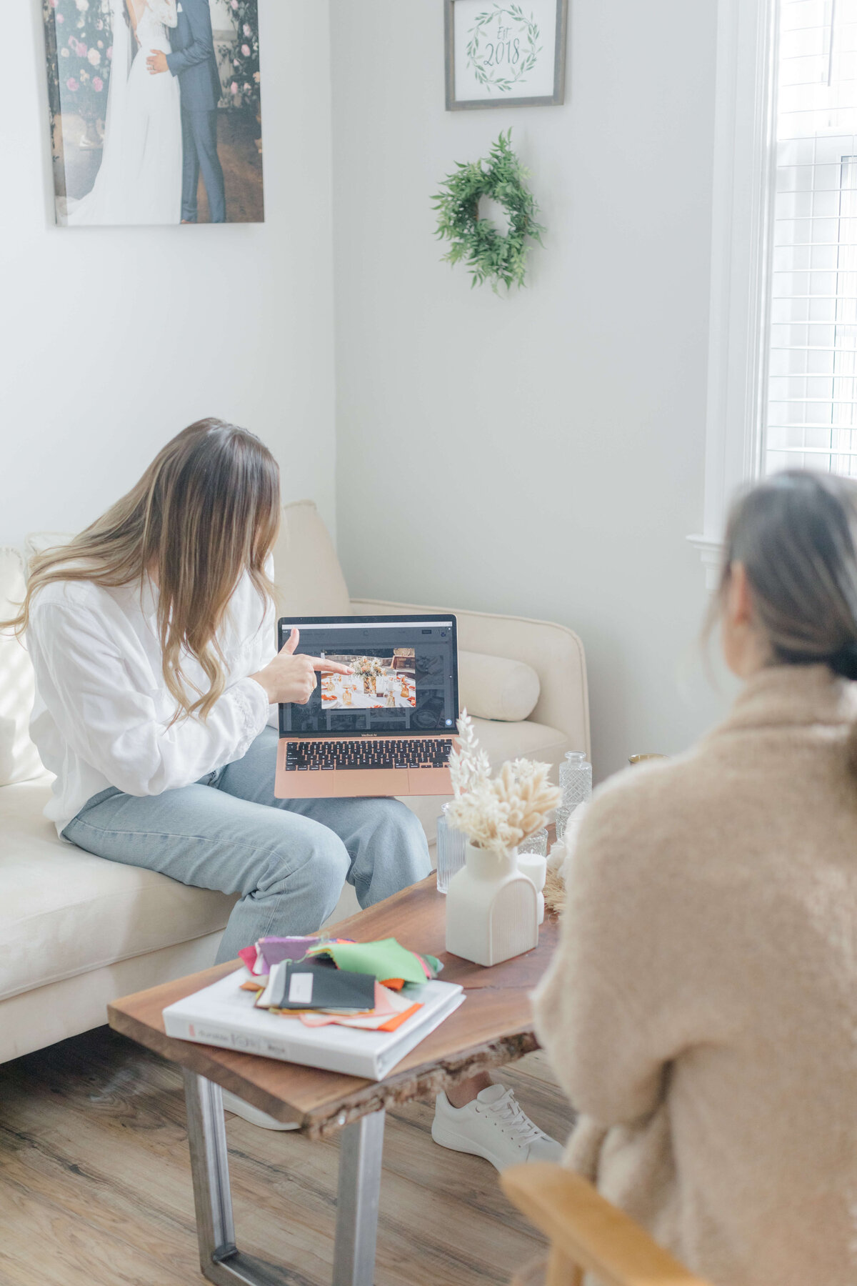 wedding planner showing couple details on a laptop