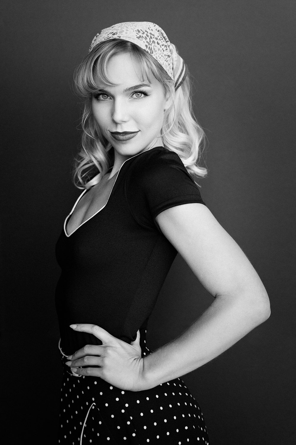 Editorial-style professional headshot photographed in a studio setting in Austin, TX.