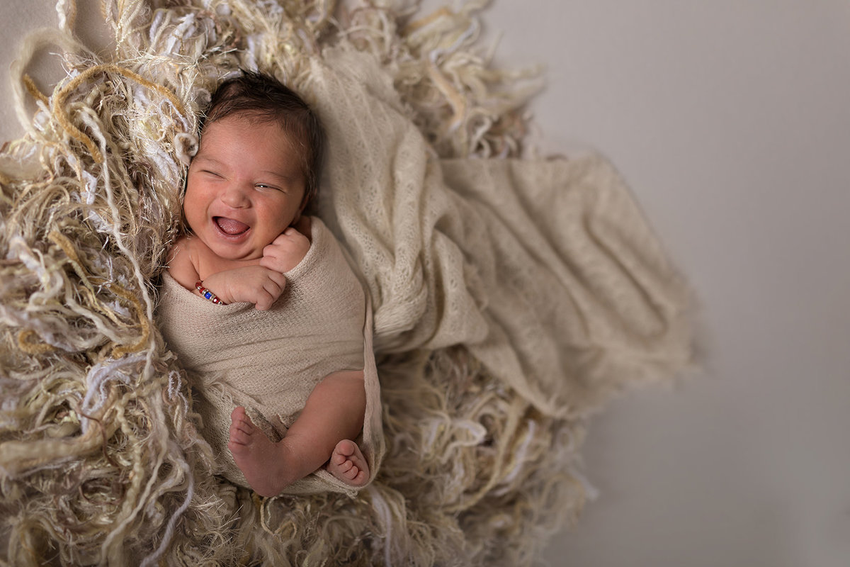 smiling newborn baby boy