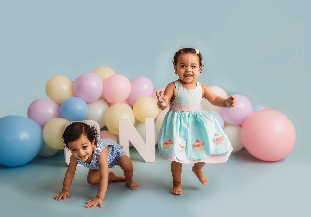 Twin siblings celebrate with a cake smash session at Asheville, NC photography studio.