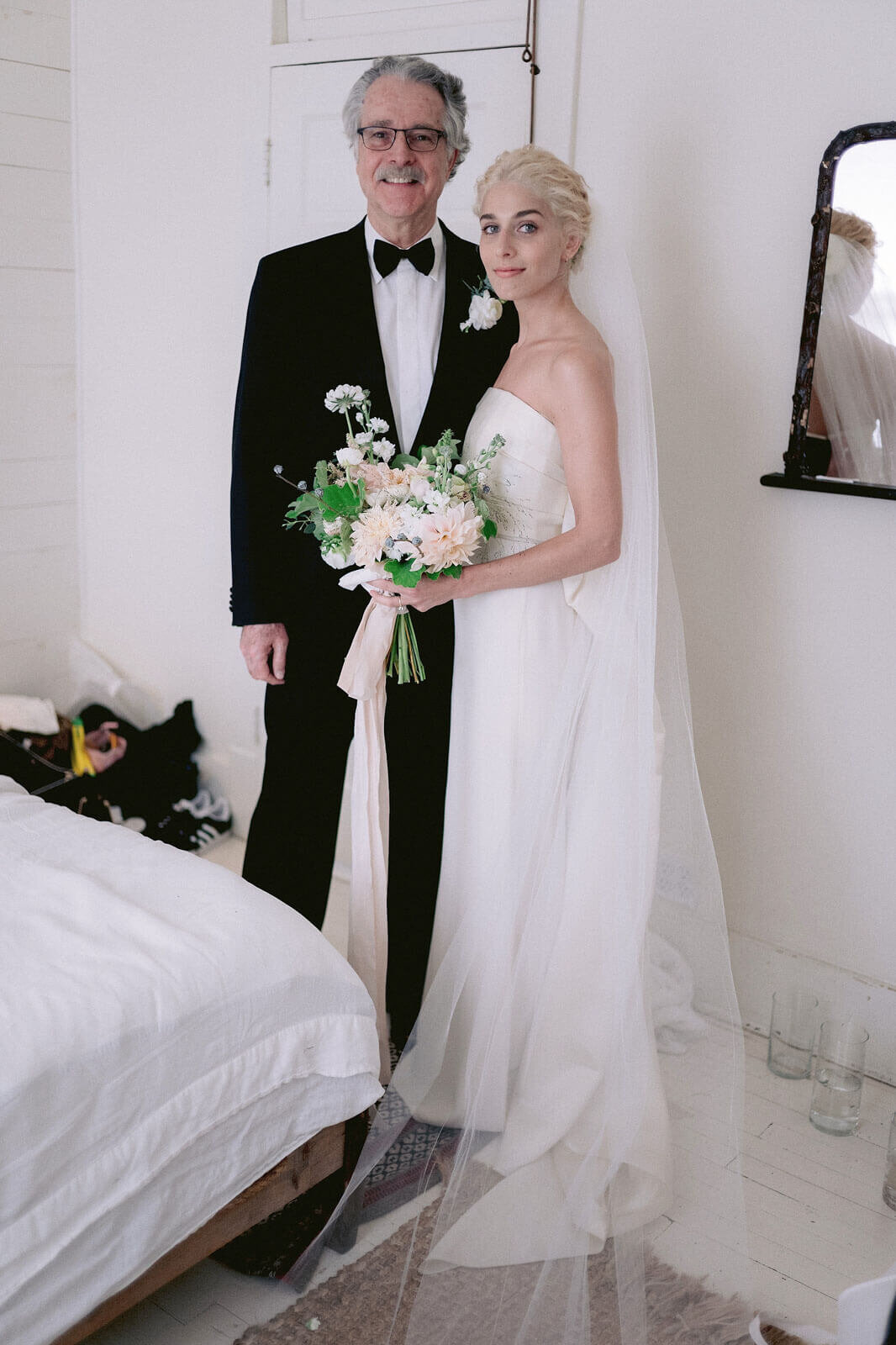 The bride and her father are inside a room in Foxfire Mountain House, New York. Wedding Image by Jenny Fu Studio