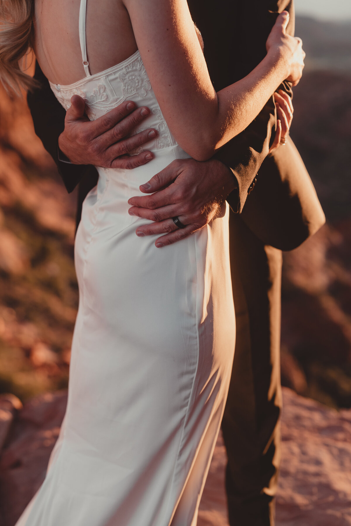 Groom adjusting bride’s veil before ceremony Sedona elopement taken by Kollar Photography
