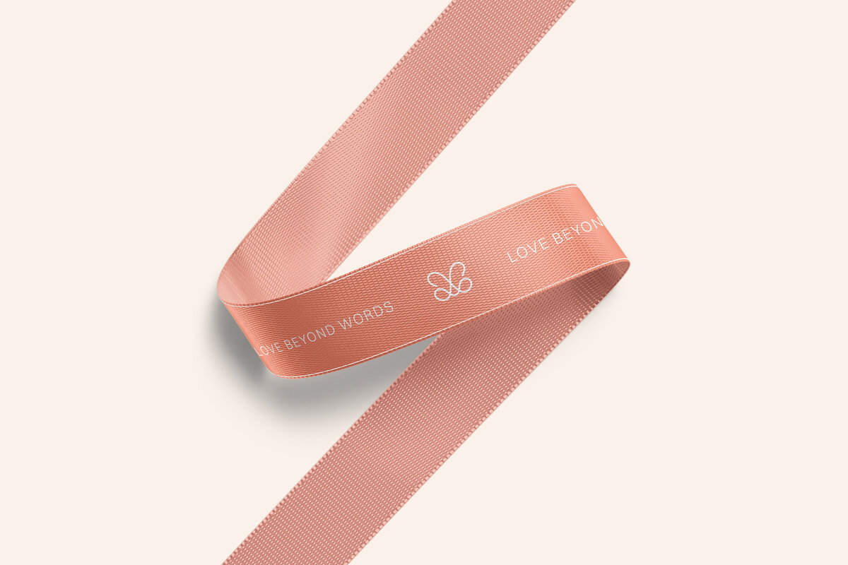 Timeless brand identity and packaging design for Berry Flower, featuring custom ribbon.